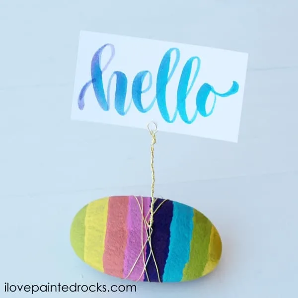 painted rock with wire card holder