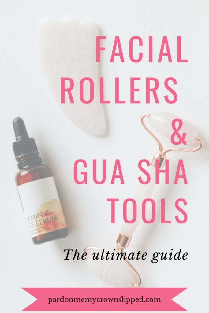 text Facial Rollers And Gua Sha Stones: The Ultimate Guide over flatlay of rose quartz stone and roller with vial of vitamin c serum Jade face roller