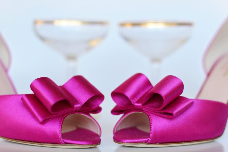 hot pink satin open toe shoes with bows. gold rimmed martini glasses in background Barbiecore Barbie Party