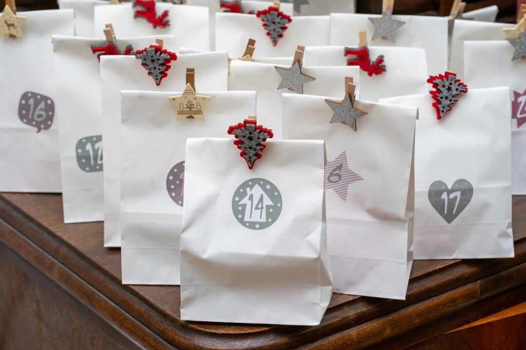 white paper bags stamped with numbers to use for advent calendar