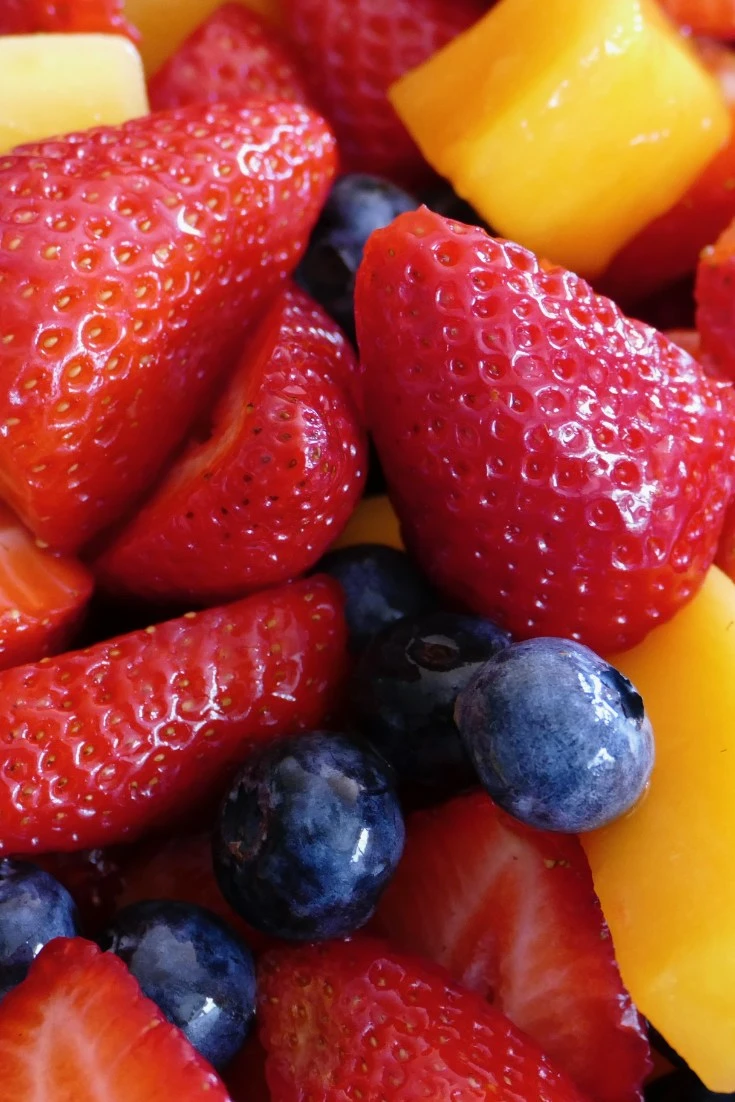 close up of fruit salad, strawberries, mango, blueberries, brunch ideas