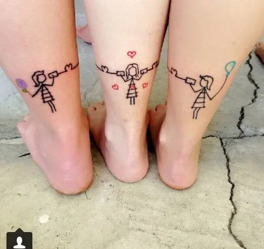 mother daughter tattoos, telephone game continues from one ankle on one person to the next, one mom, two daughters or sisters
