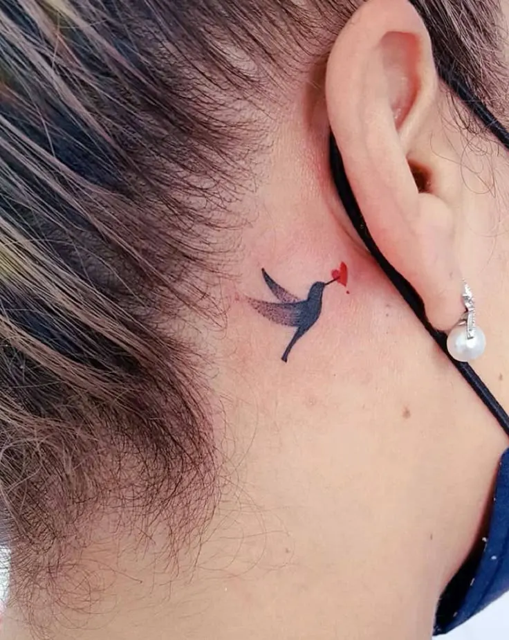 hummingbird with heart tattoo behind ear tattoo