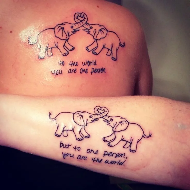 #matchingtattoos #motherdaughtertattoos #tattooideas #quotetattoo #sayingstattoo #handwritingtattoo #elephanttattoo one person: to the world you are one person, the other: but to one person, you are the world